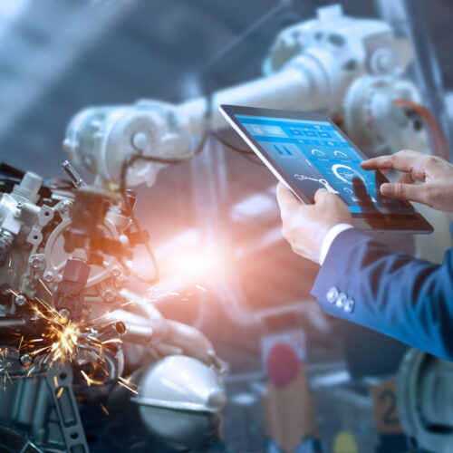 Manager engineer check and control automation robot arms machine Manager engineer check and control automation robot arms machine in intelligent factory industrial on real time monitoring system software. Welding robotics and digital manufacturing operation.